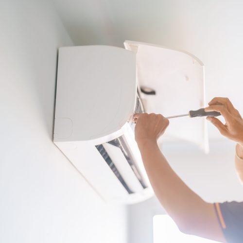 Man technician maintenance air conditioner. Purification system for cleaning dust PM2.5 and virus in home. Repair, Washing, Conditioning Service, Allergy, Pure air, health, Wellness and Air Pollution